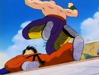 Tien Shinhan (Dragon Ball series) deals a critical blow to Yamcha's leg using the Super Knee Uppercut, thus breaking it.