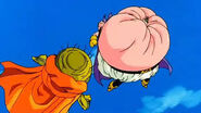 Majin Buu (Dragon Ball Z) crushing Son Goku in his abdomen.