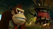 Kalimba of the Tiki Tak Tribe (Donkey Kong Country Returns) fails to hypnotize Donkey Kong.