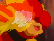 Blaine's Magmar (Pokémon) using Fire Punch to infuse its fist with fire.