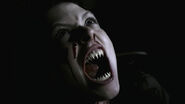 A Vampire (Supernatural) bares her fangs.