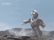 Ultraman Nexus (Ultraman) fires Cross-Ray Schtrom.