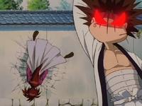 ...and punches Kenshin so hard, it sent him smashing into the concrete wall.