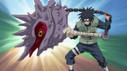 Kōtetsu Hagane (Naruto) summoning his conch-shell looking mace, which can transform into a bird-like weapon and pierce through ground.