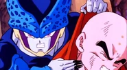 A Cell Jr. (Dragon Ball Z) extends his nails into claws to threaten Krillin.