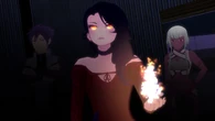 Cinder Fall (RWBY) creates a flame in her hand.