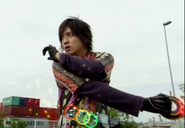 Eiji Hino (Kamen Rider franchise) scans the medals in his OOO Driver belt to become Kamen Rider OOO TaToBa form.