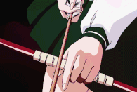 Kagome Higurashi (InuYasha) infuses an arrow with spiritual power.