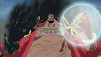 Blackbeard (One Piece) holding a shock wave bubble in his left hand.