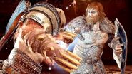 Kratos (God of War) resisting Modi's electric attacks through the power of his Spartan Rage.