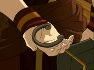 Toph's (Avatar: The Last Airbender) bracelet is made out of a meteorite Sokka gave her, that she shaped herself by using bending.