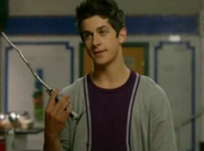 Justin Russo (Wizards of Waverly Place) holding the family wand.