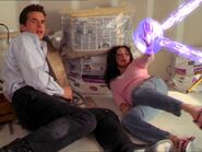 Prue Halliwell (Charmed) deflects a energy beam.