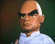 The Hood (Thunderbirds) displays his hypnotic powers.