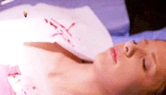 Willow Rosenberg (Buffy the Vampire Slayer) extracting a bullet from Buffy's chest.