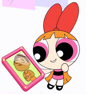 Blossom holding a picture of Cavon