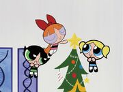 Buttercup and Bubbles watch Blossom put the star on the Christmas tree