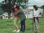 Gai teaches Ako how to play golf well