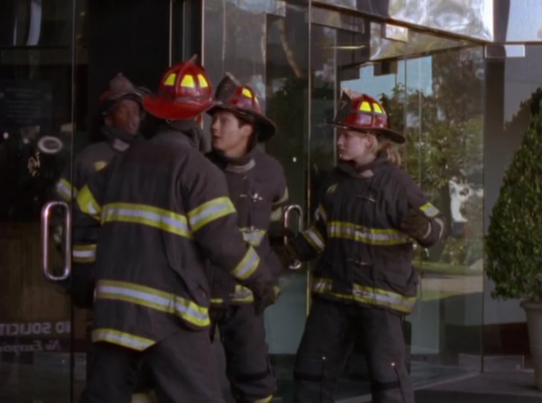 Kai, Maya and the other Rangers disguised as firemen while evacuating the people from the building