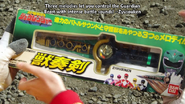 Yuuko gives Nobuo a package of the DX Zyusouken toy to restore the Powerful Rangers to normal.