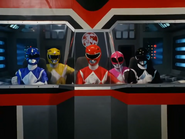 The Power Rangers in Dino Megazord's cockpit