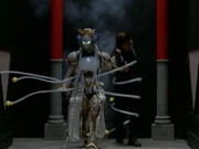 Jellica ensnares Dai Shi with her tentacles.