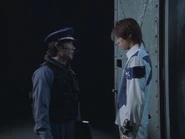 Tetsu asks the guard about where the prisoned Genio is.