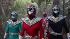 Izzy, Amelia, Javi, and Mick prepare for a Zord battle.