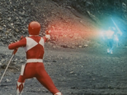 The Red Ranger firing upon the Green Ranger.