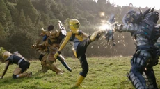 The Rangers fight Snide and Goldar Maximus.