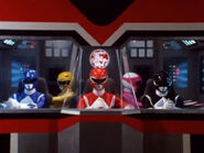 The Power Rangers in Dino Megazord's cockpit