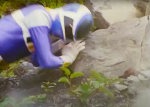 T.J. strikes his head on a rock