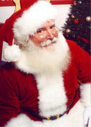 Jonathan G Meath portrays Santa Claus