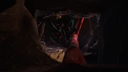 Doey attempting to grab the Player while they're crawling through a cavern.