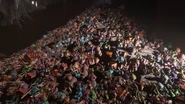 An immense pile of dead toys The Player uses to enter the prison.