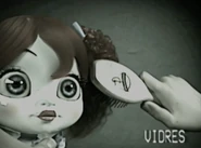 Poppy is getting her hair brushed.