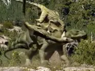 26C12828-E191-4D5D-8279-50288925982A.webp (176 KB) A pack of Utahaptors attacking an Iguanodon.