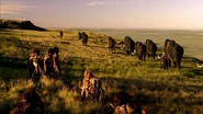 A Woolly Mammoth herd being stalked a tribe of Neanderthals.