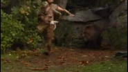 A Cave Bear chasing a Cro-Magnon out of it's cave.