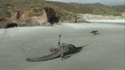 The pair of Quetzalcoatlus drive T. rex away