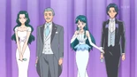 Wataru stands on stage with his family