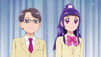 Yuuto and Riko stand before the student body
