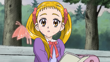 Urara notices a butterfly in episode 2