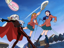 Nagisa hits Pisard's hand with her lacrosse stick, causing him to let go of Mepple.