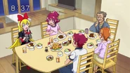 Regina eating with the Aida family