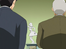 Two men observe Nagisa's "work of art."