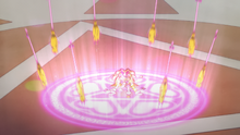 Cure Mofurun summons brooms to defend Mirai