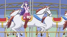 Miki rides on the carousel