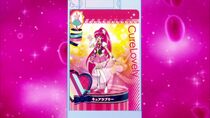 Two PreCards overlap to create Cure Lovely's outfit