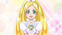 Cure Rhythm giving her 10th anniversary congratulatory message at the beginning of episode 9 of Happiness Charge Pretty Cure!